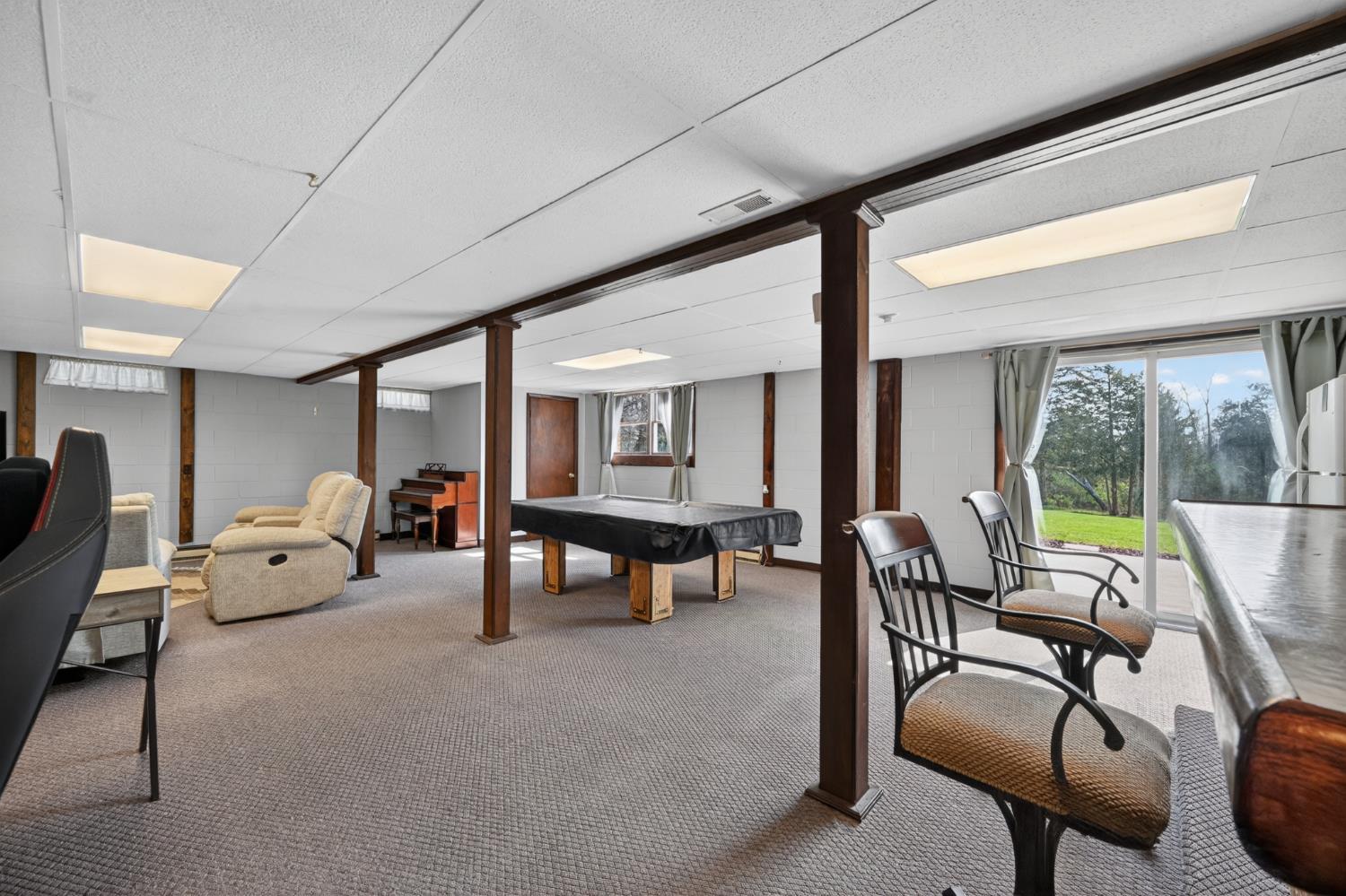 8093 Highway 350 Aurora, IN 47001 - Photo 22 of 50 Large, nicely Finished Recreation Room accompanied with a /walk, 1/2 bathroom. , Pool Table,dry bar.