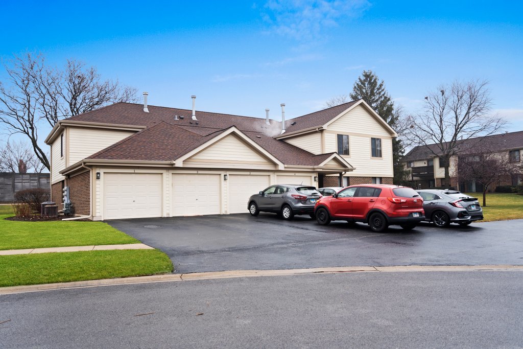 918 East Kings Row, Unit 1 Palatine, IL 60074 - Photo 2 of 36 a car parked in front of a house