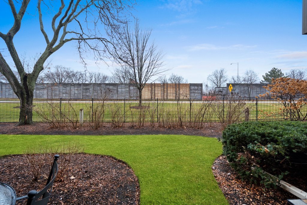 918 East Kings Row, Unit 1 Palatine, IL 60074 - Photo 34 of 36 a view of a backyard with a garden and plants