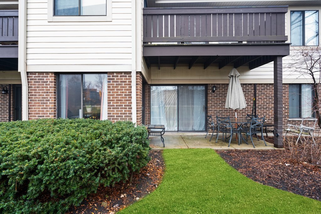 918 East Kings Row, Unit 1 Palatine, IL 60074 - Photo 36 of 36 a view of a house with a yard and sitting area
