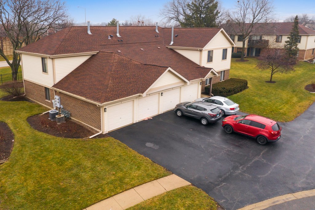 918 East Kings Row, Unit 1 Palatine, IL 60074 - Photo 5 of 36 a view of a white house with a yard