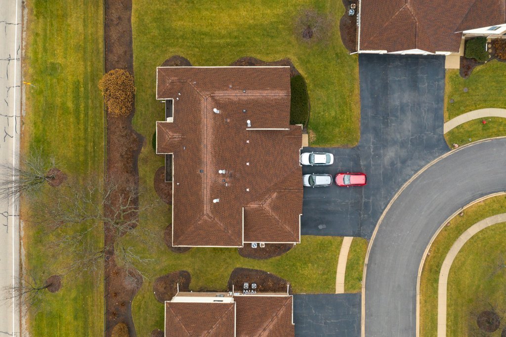 918 East Kings Row, Unit 1 Palatine, IL 60074 - Photo 7 of 36 an aerial view of a house with a swimming pool