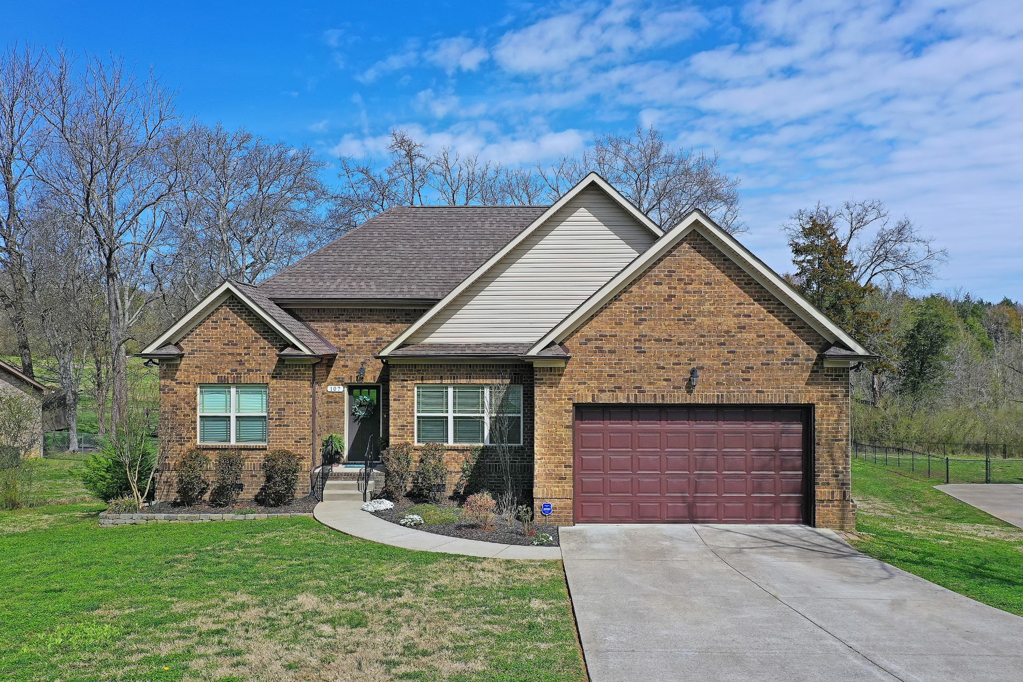 a view of a house with garden and yard