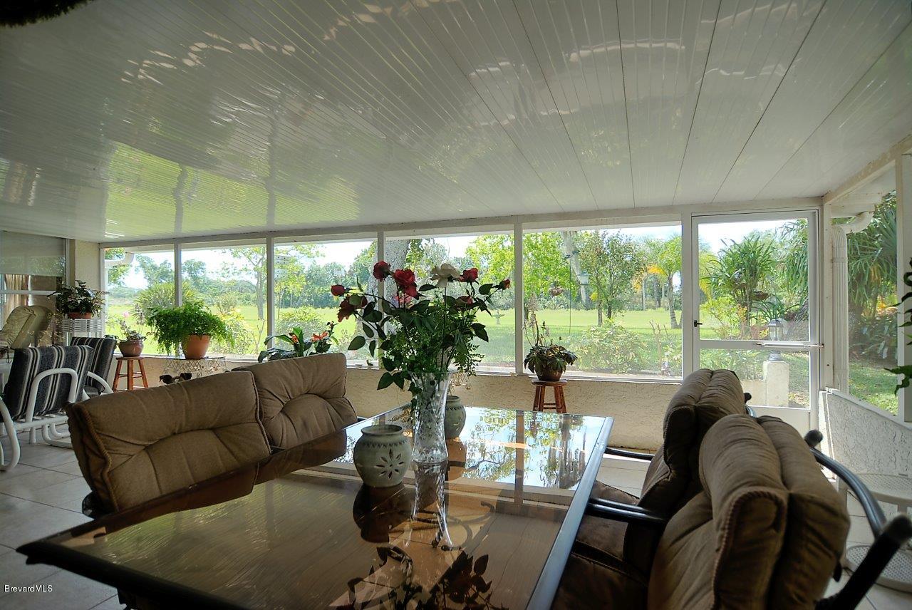 1180 Meadowbrook Road Northeast Palm Bay, FL 32905 - Photo 11 of 14 porch (2).jpg