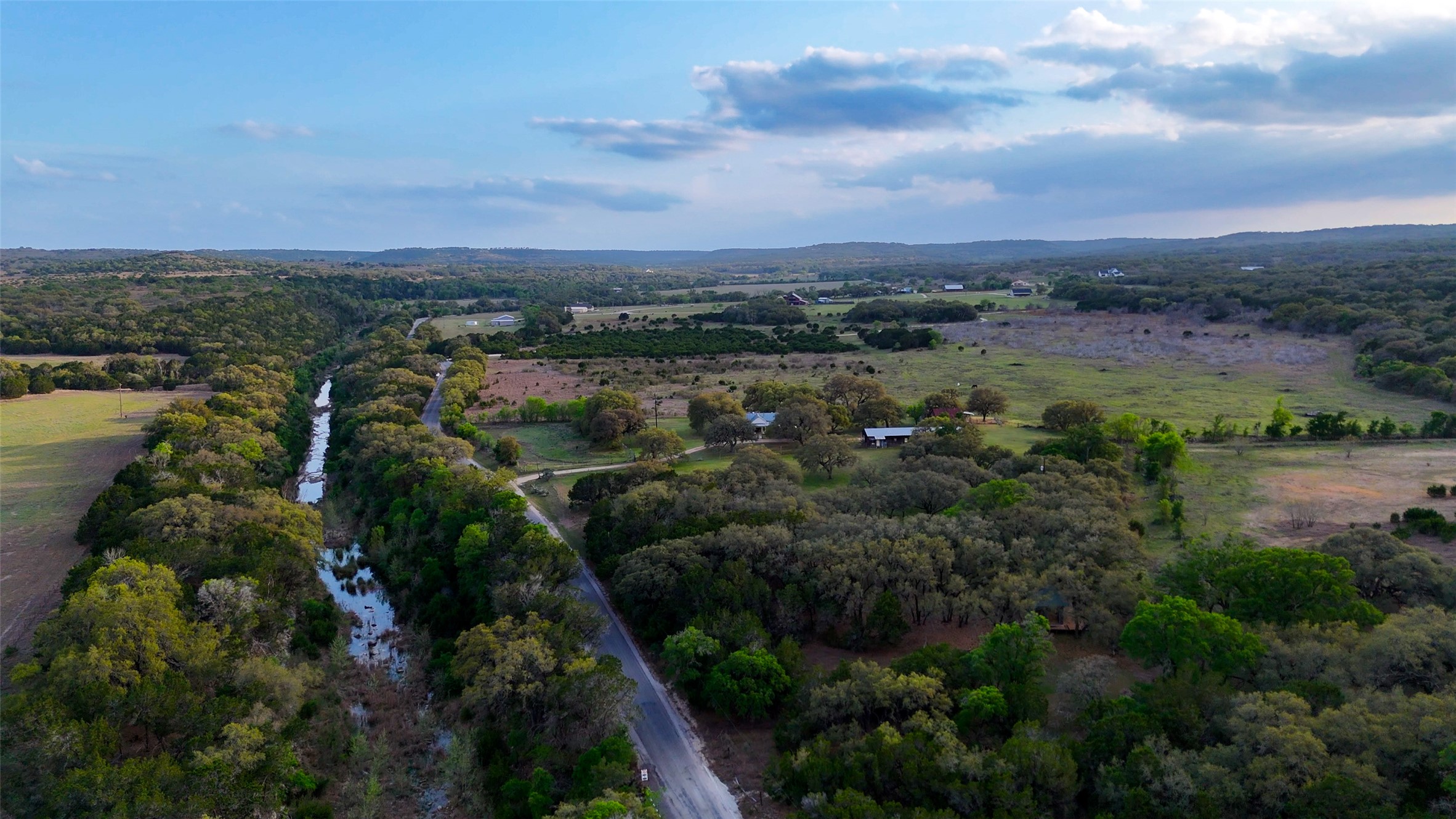 1294 Crabapple Road Blanco, TX 78606 - Photo 30 of 38 Aerial view reveals winding Crabapple Creek flowing through the +/-57 acres