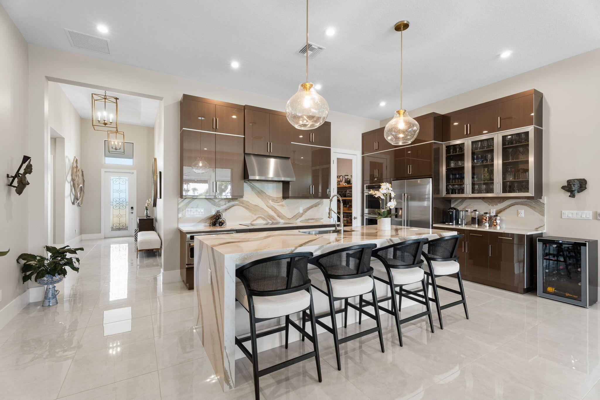 a large kitchen with a table and chairs