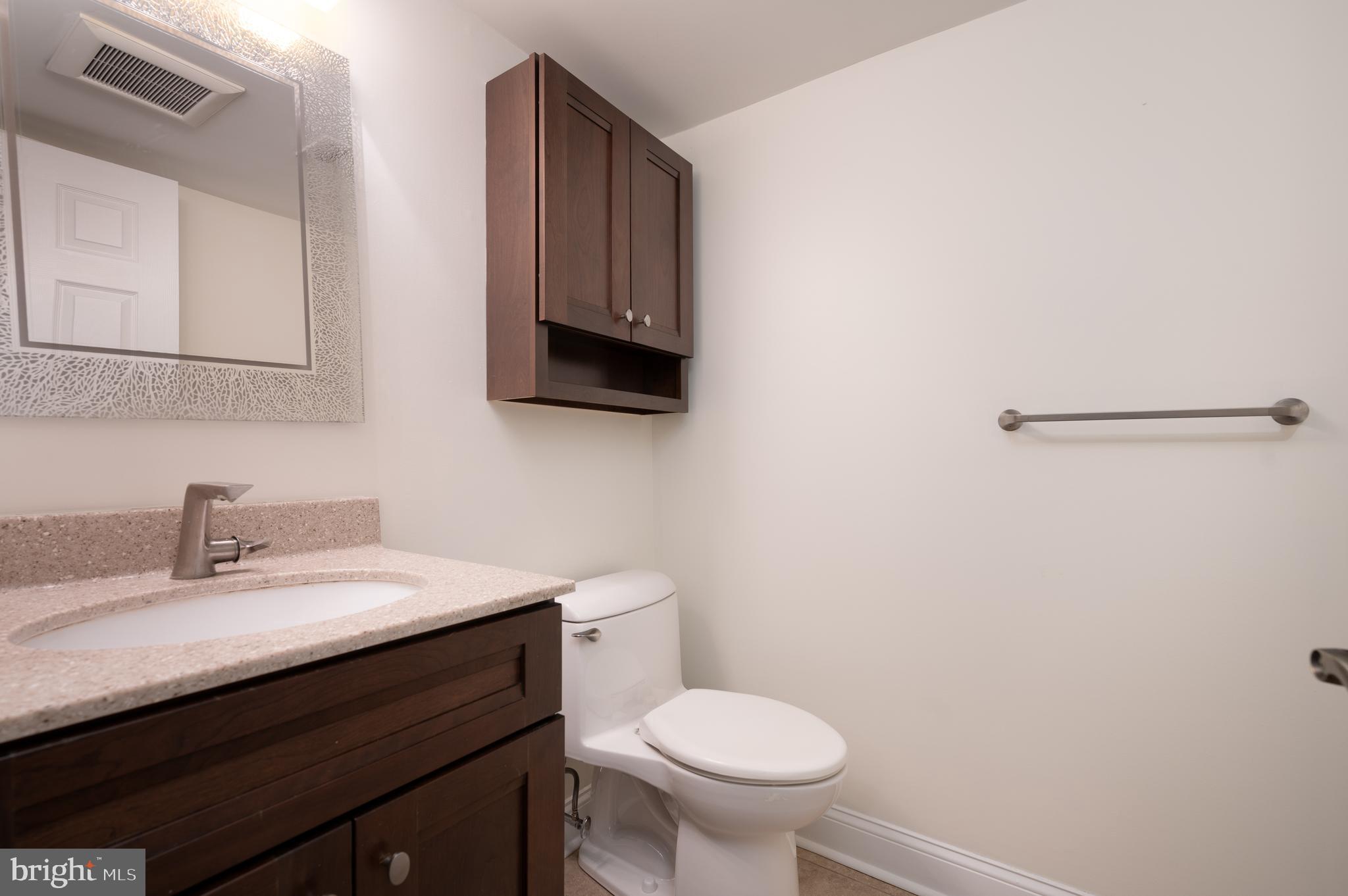 128 Birch Knoll Road Wilmington, DE 19810 - Photo 25 of 51 a bathroom with a sink and a toilet