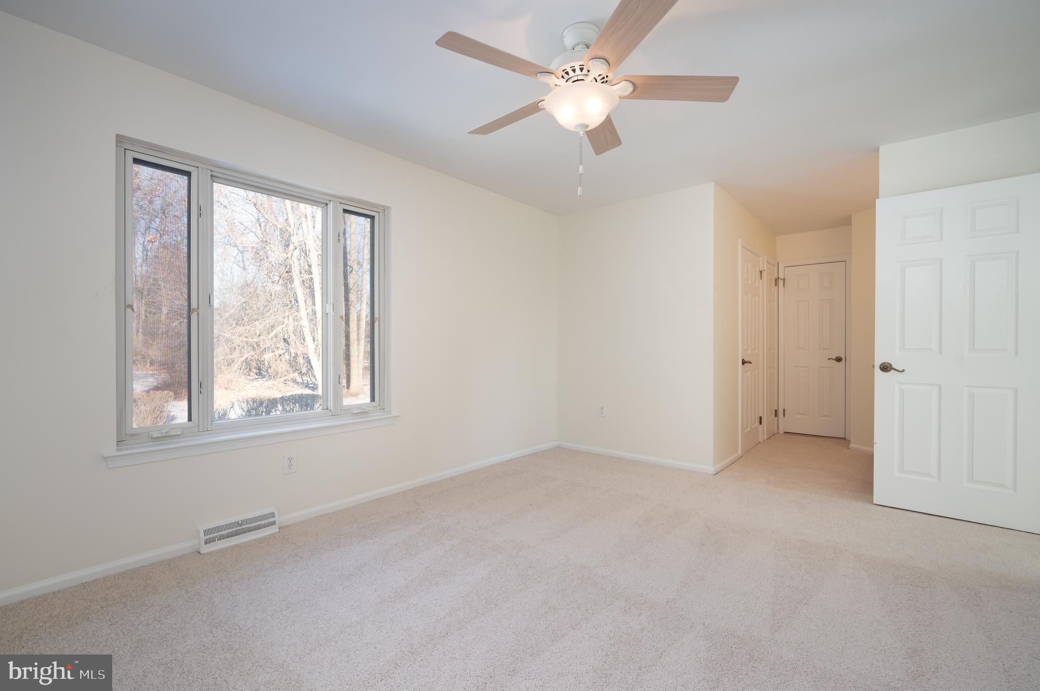 128 Birch Knoll Road Wilmington, DE 19810 - Photo 33 of 51 an empty room with a window and a fan