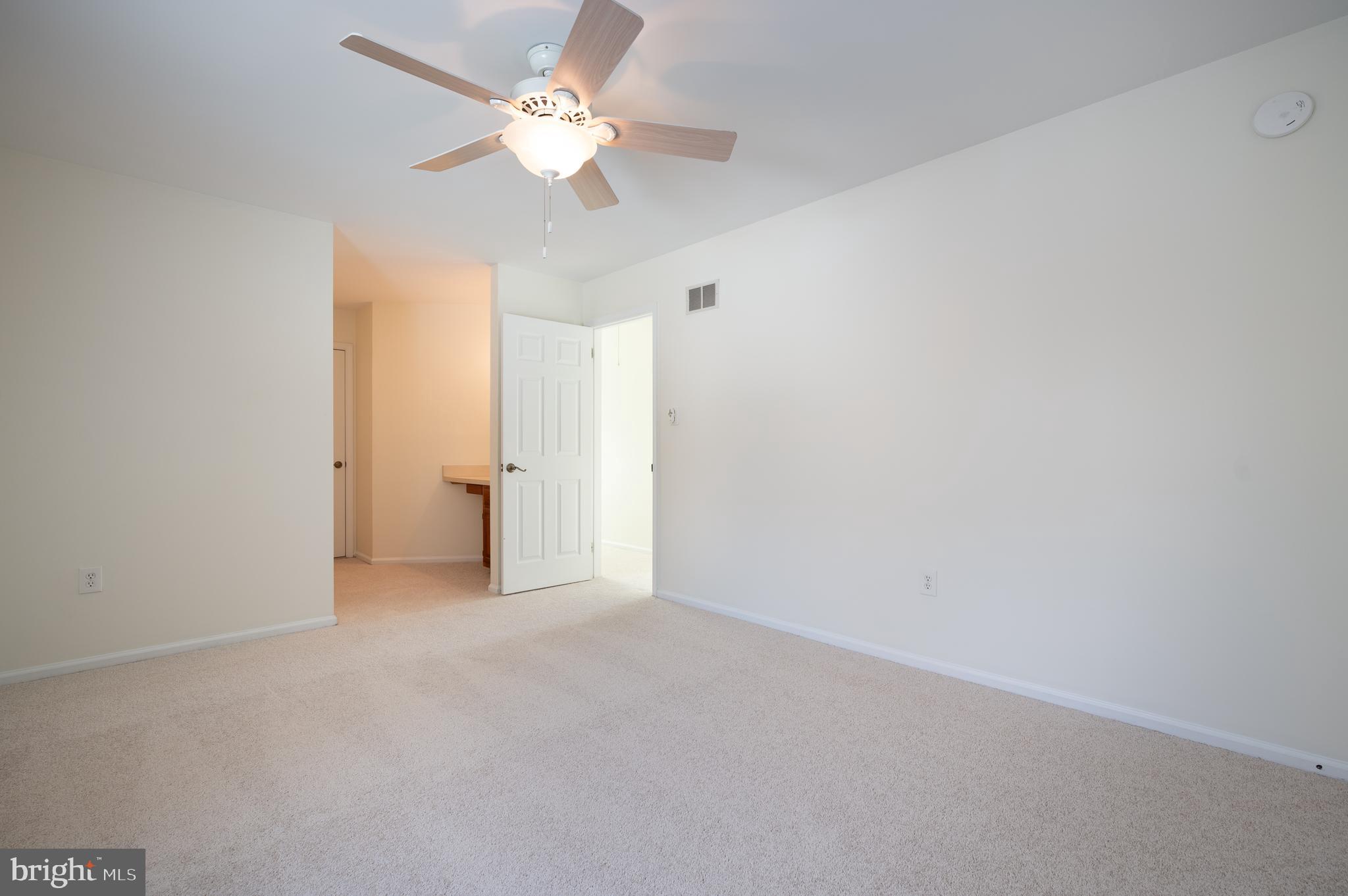 128 Birch Knoll Road Wilmington, DE 19810 - Photo 34 of 51 a view of an empty room with a ceiling fan