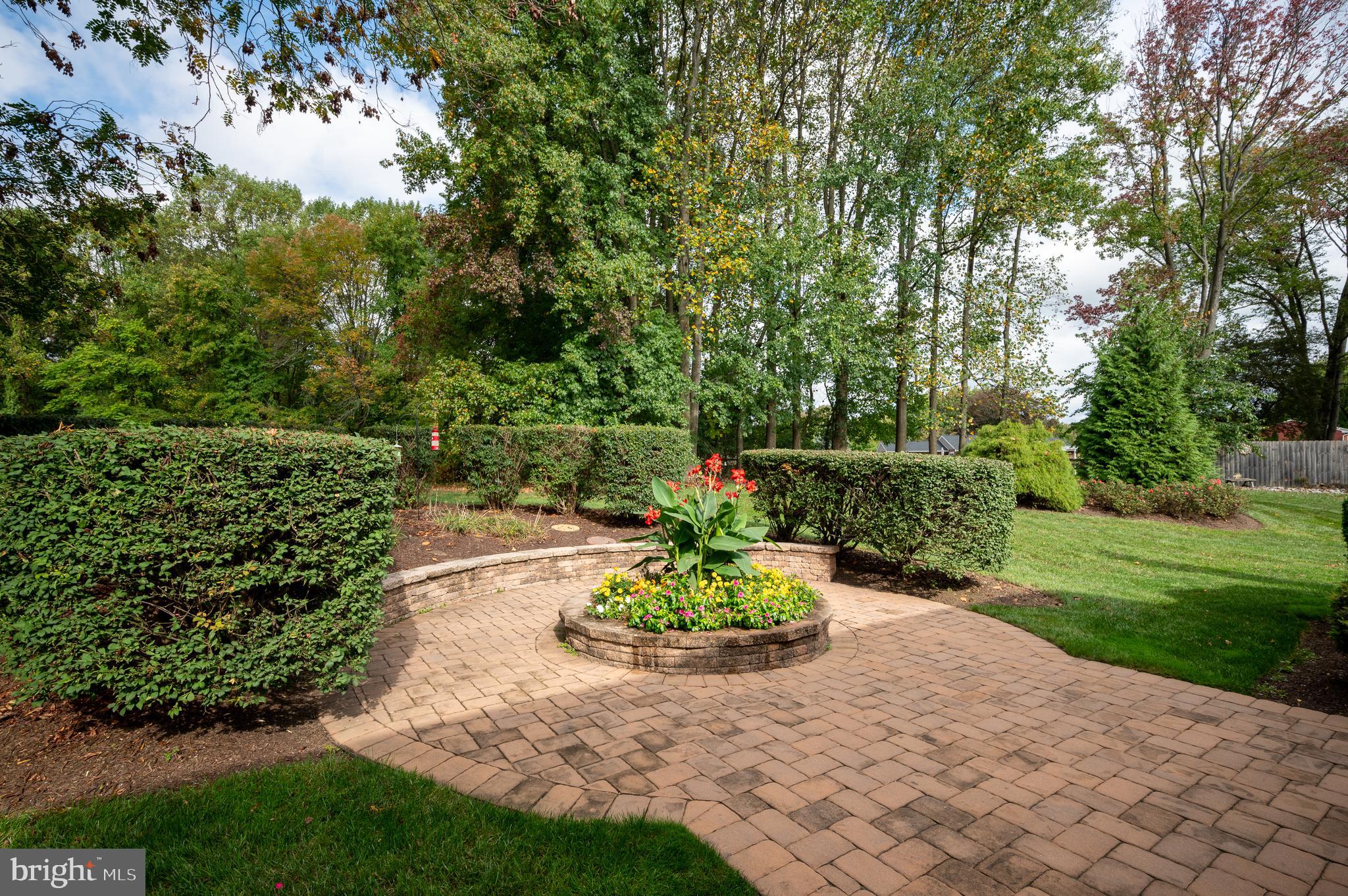 128 Birch Knoll Road Wilmington, DE 19810 - Photo 45 of 51 a view of a garden with a fountain