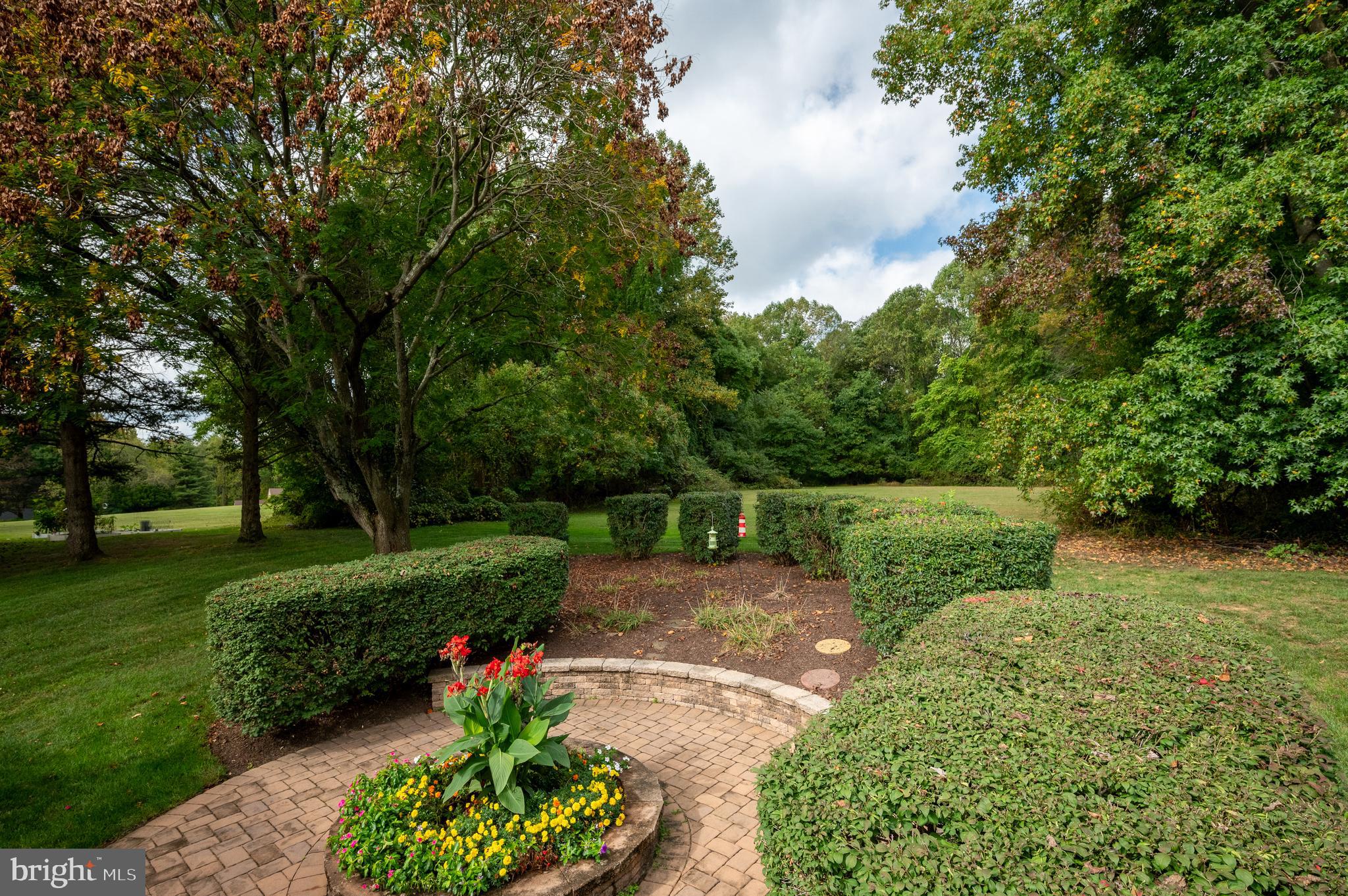 128 Birch Knoll Road Wilmington, DE 19810 - Photo 49 of 51 a view of a garden with a fountain