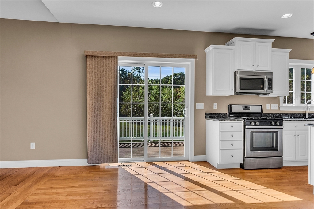 17 Runaway Brook Road Lancaster, MA 01523 - Photo 19 of 42 a view of kitchen with granite countertop a stove top oven a sink and a granite counter top