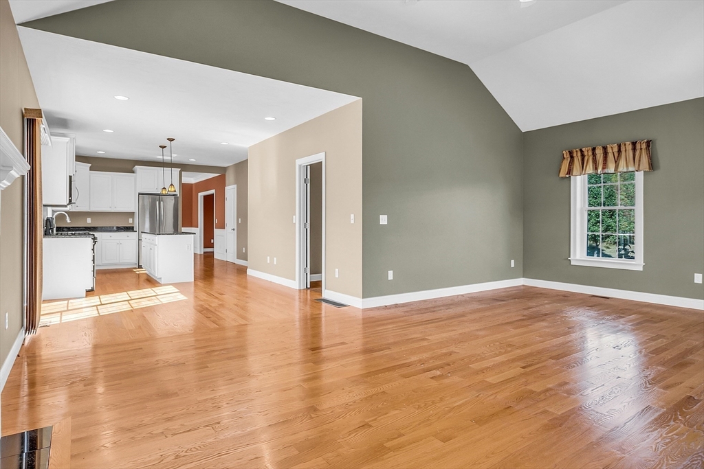 17 Runaway Brook Road Lancaster, MA 01523 - Photo 20 of 42 a view of an empty room with kitchen and window