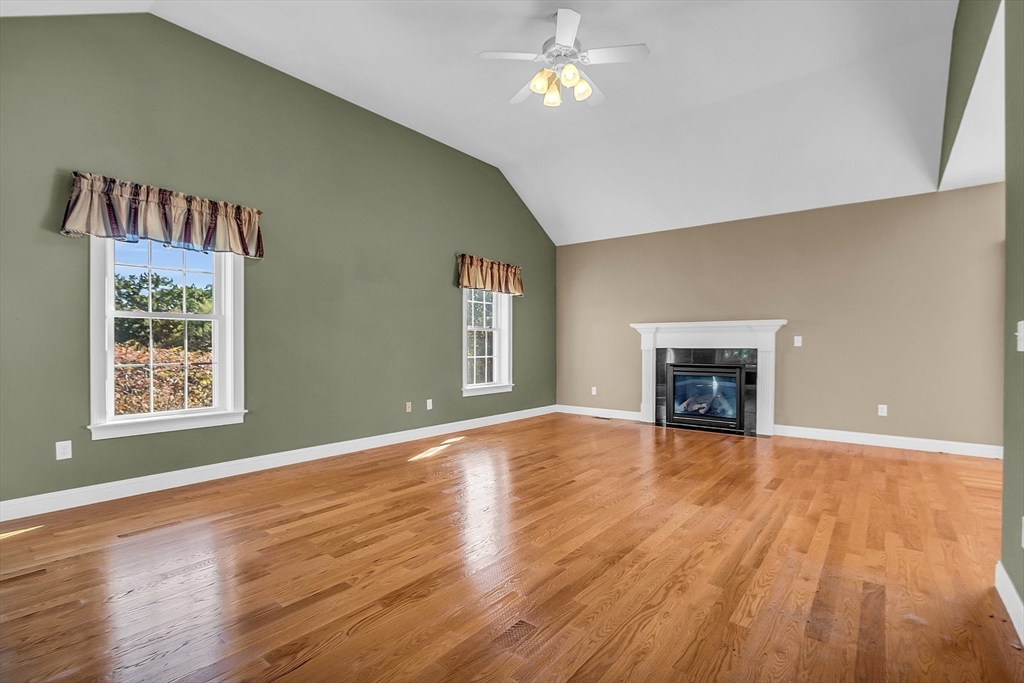 17 Runaway Brook Road Lancaster, MA 01523 - Photo 22 of 42 an empty room with windows and fireplace