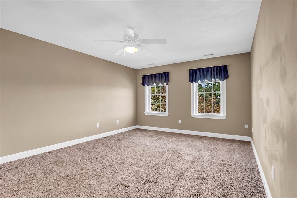 17 Runaway Brook Road Lancaster, MA 01523 - Photo 27 of 42 a view of an empty room with windows