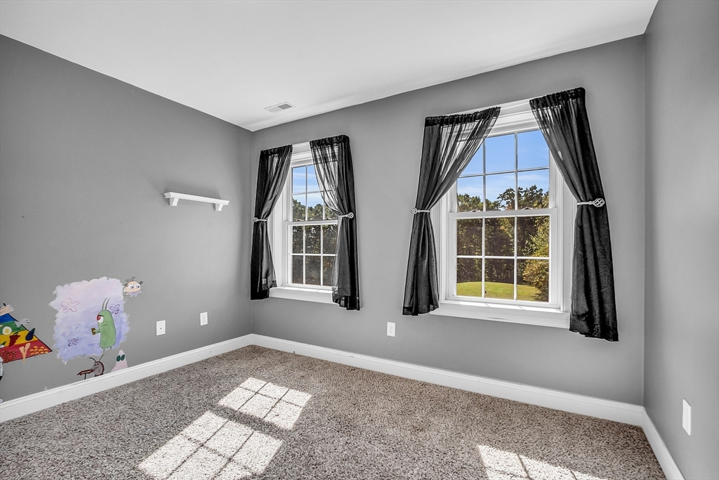 17 Runaway Brook Road Lancaster, MA 01523 - Photo 30 of 42 a view of an empty room with a window