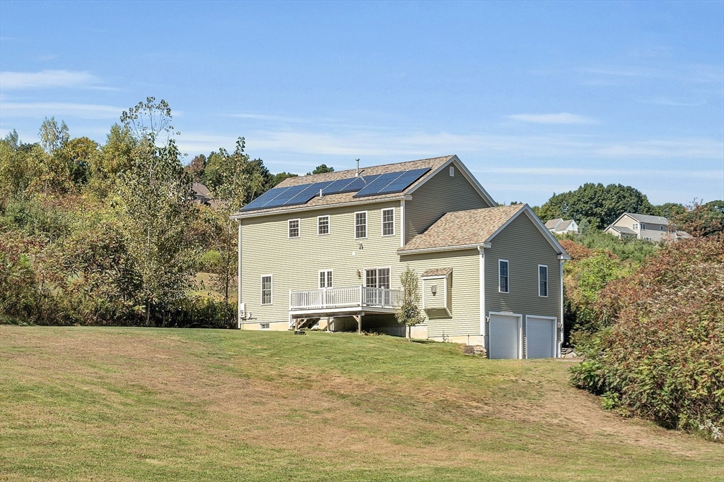 17 Runaway Brook Road Lancaster, MA 01523 - Photo 35 of 42 a front view of a house with a garden