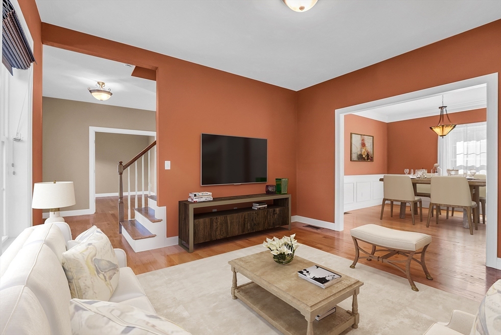 17 Runaway Brook Road Lancaster, MA 01523 - Photo 10 of 42 a living room with furniture and a flat screen tv