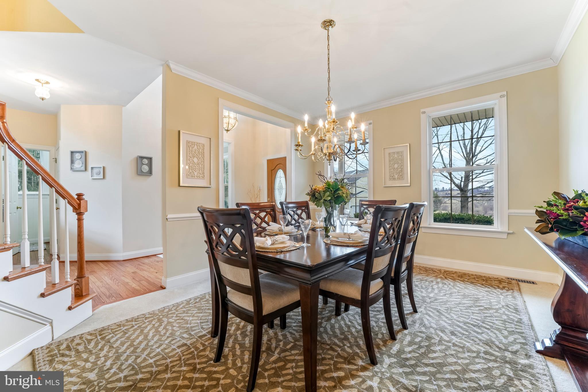 730 Garden Drive Kennett Square, PA 19348 - Photo 13 of 39 a dining room with furniture a chandelier and wooden floor