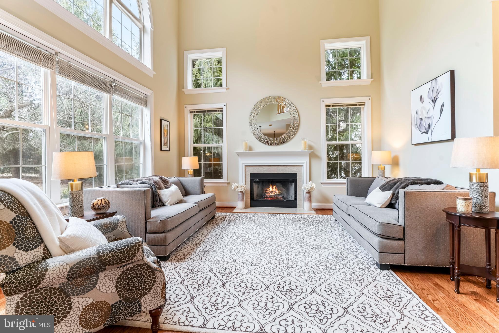 730 Garden Drive Kennett Square, PA 19348 - Photo 14 of 39 a living room with furniture a large window and a fireplace
