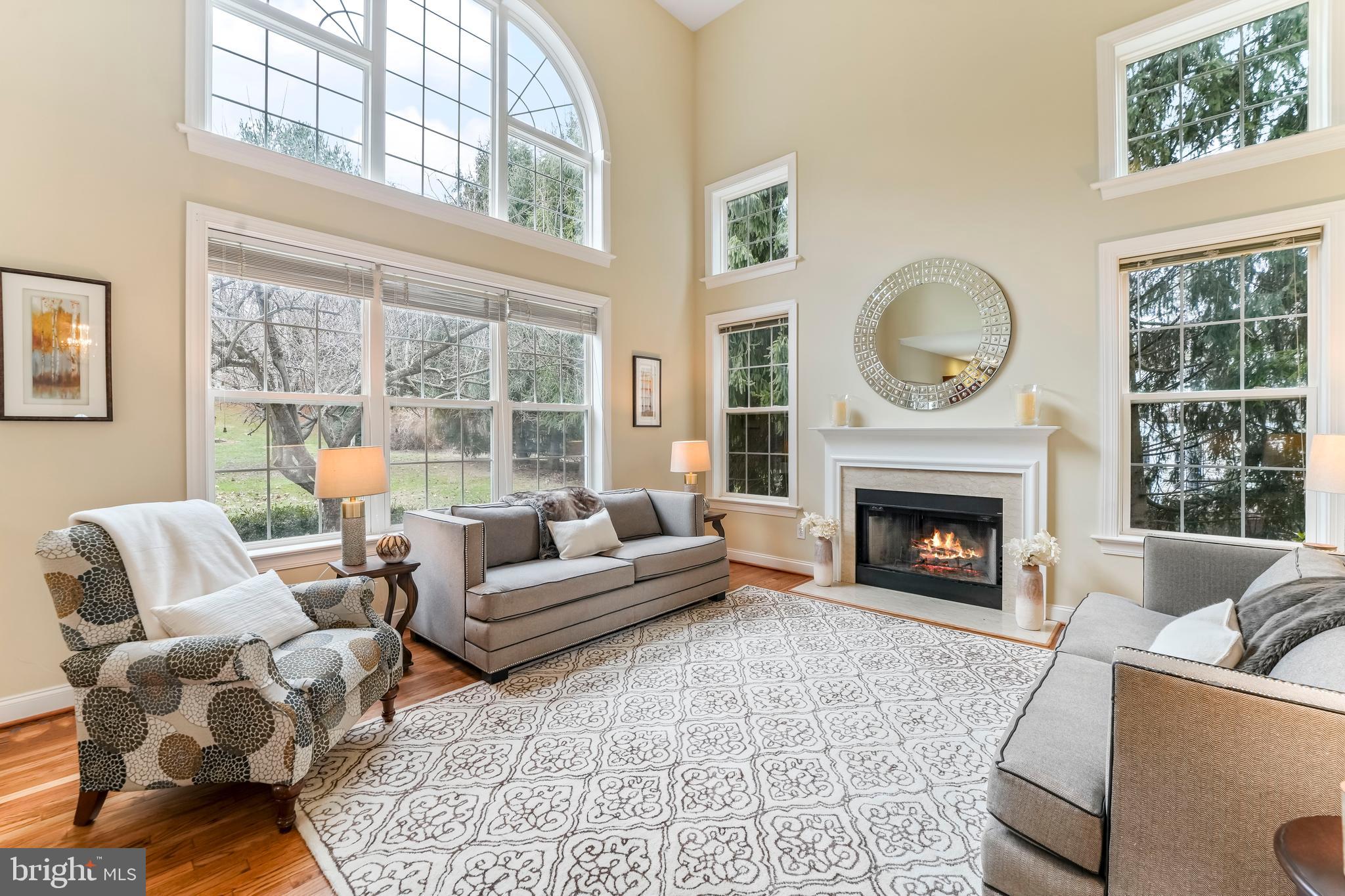 730 Garden Drive Kennett Square, PA 19348 - Photo 15 of 39 a living room with furniture a large window and a fireplace