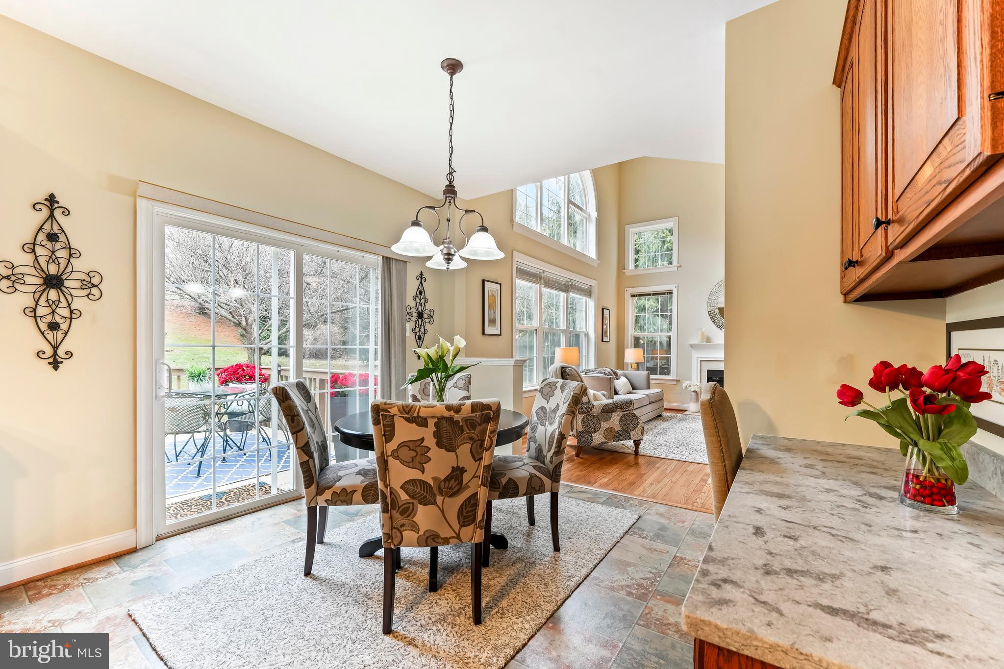 730 Garden Drive Kennett Square, PA 19348 - Photo 20 of 39 a view of a dining room and livingroom with furniture wooden floor a chandelier