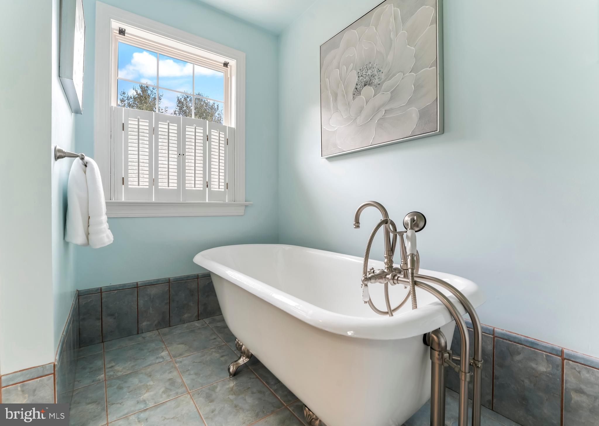 730 Garden Drive Kennett Square, PA 19348 - Photo 29 of 39 a bath tub sitting in a bathroom next to a window
