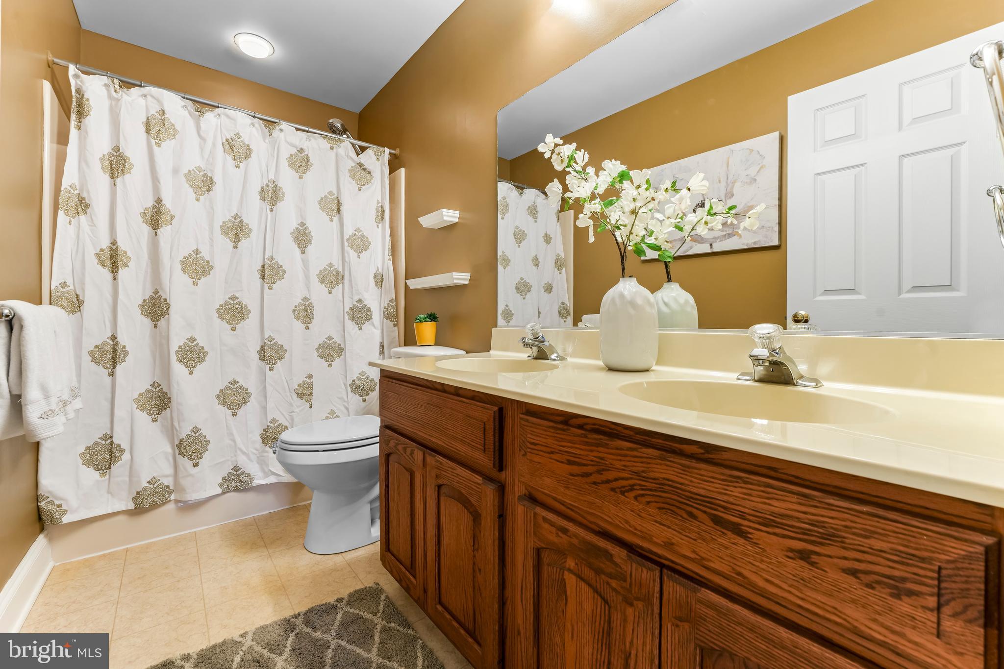 730 Garden Drive Kennett Square, PA 19348 - Photo 30 of 39 a bathroom with a sink and a mirror