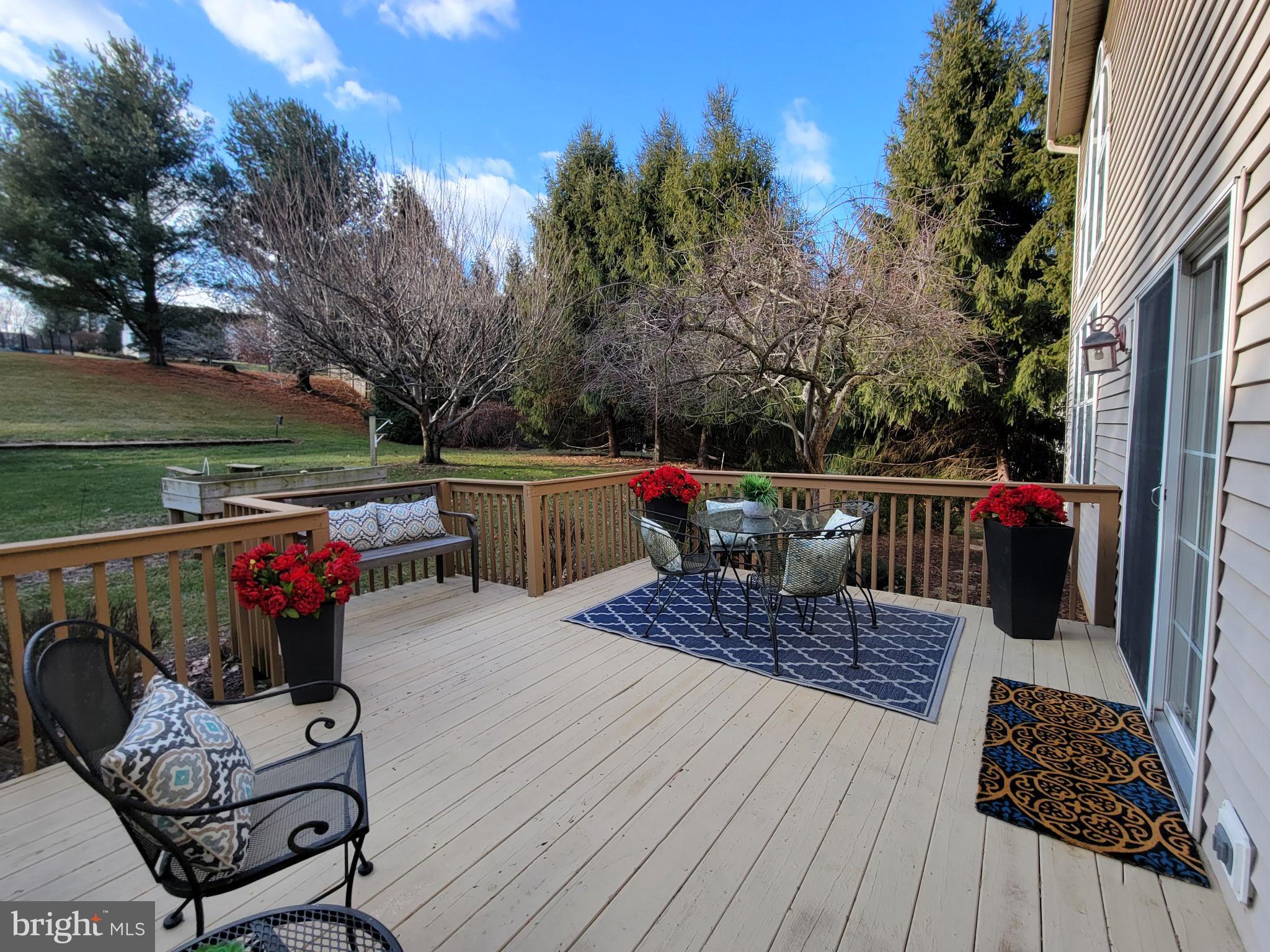 730 Garden Drive Kennett Square, PA 19348 - Photo 33 of 39 a roof deck with table and chairs and wooden floor