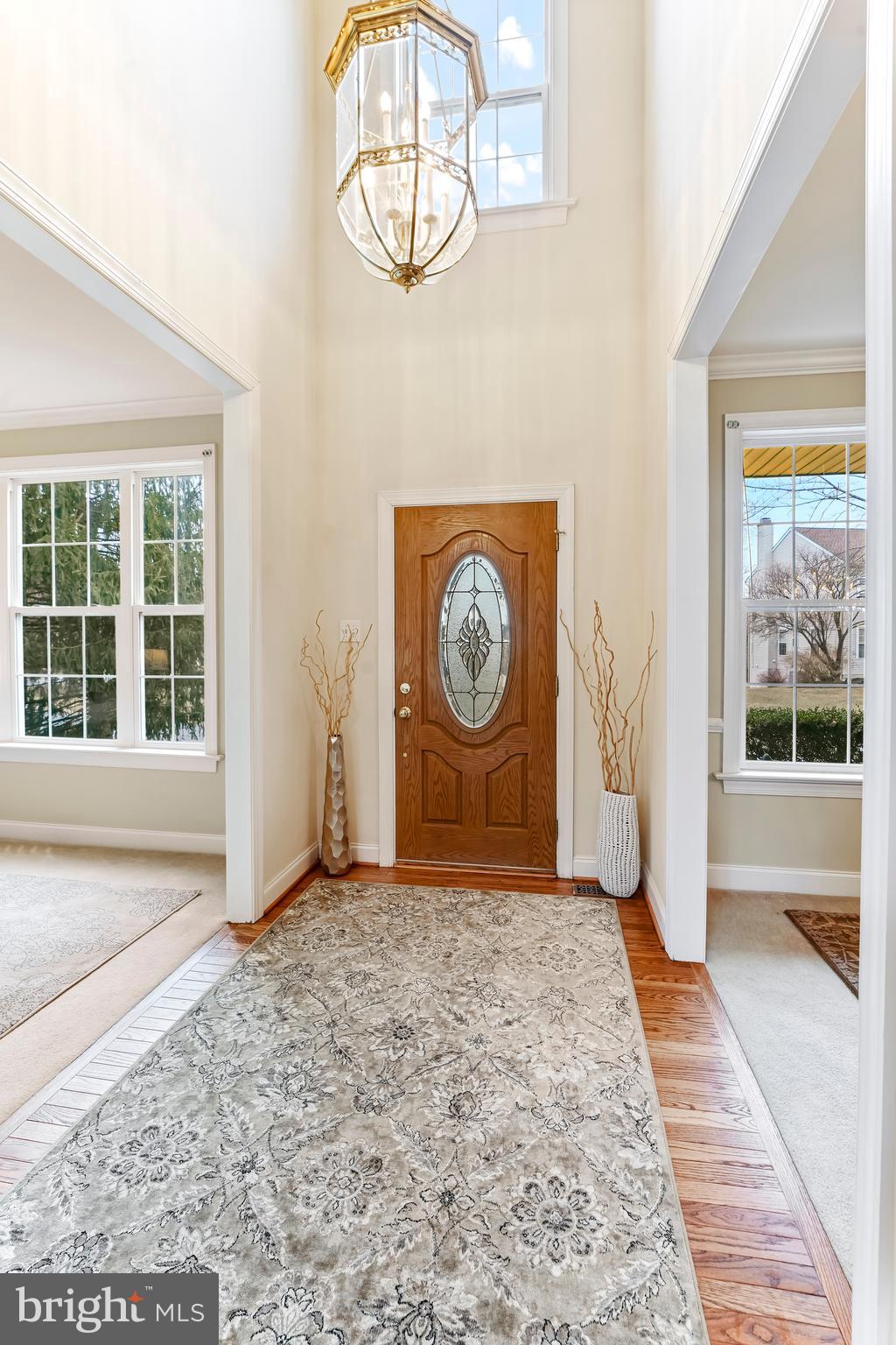 730 Garden Drive Kennett Square, PA 19348 - Photo 4 of 39 an empty room with entrance door and windows