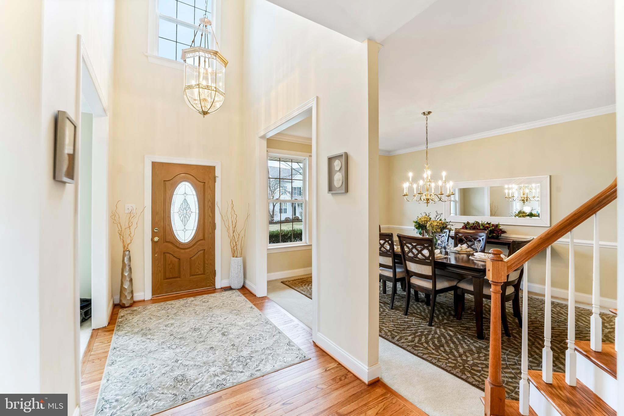 730 Garden Drive Kennett Square, PA 19348 - Photo 9 of 39 a view of a dining room and hall with wooden floor