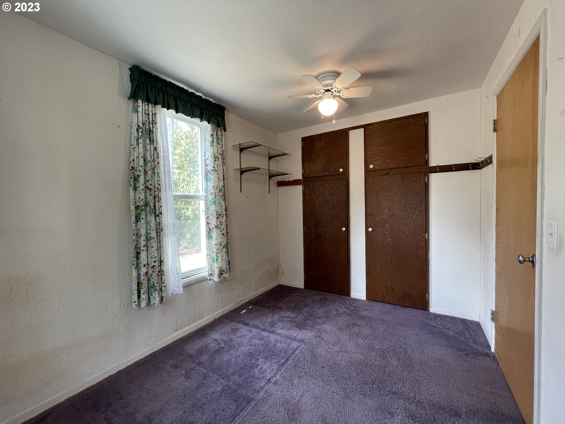 430 E Street Springfield, OR 97477 - Photo 23 of 29 an empty room with windows and closet