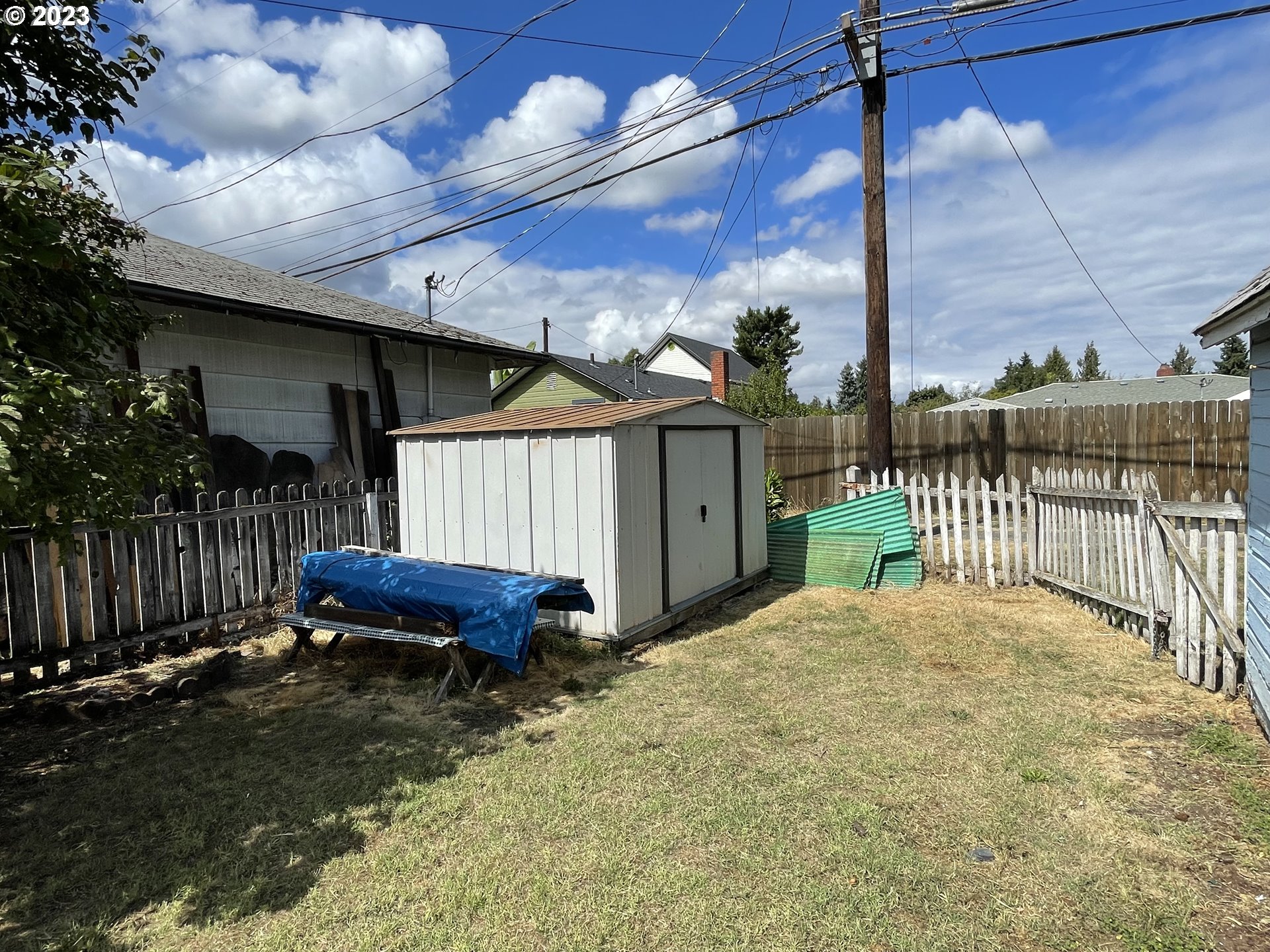 430 E Street Springfield, OR 97477 - Photo 9 of 29 a view of a backyard with a small cabin and wooden fence