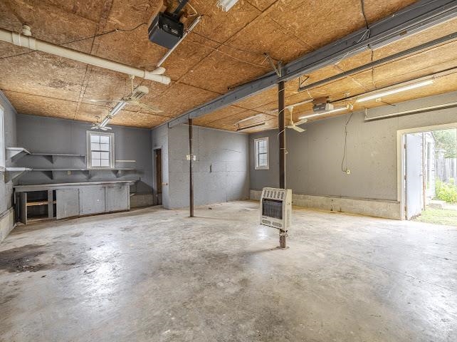 660 Hinton Road Counce, TN 38326 - Photo 40 of 40 Concrete flooring, built-in cabinetry, exposed ceiling beams, and dual windows
