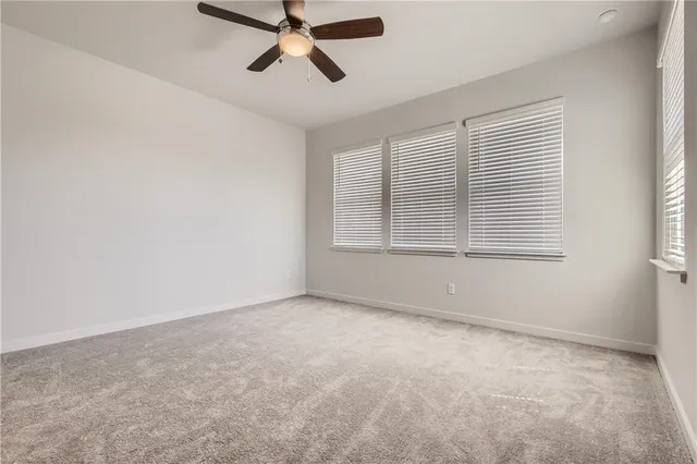 a bathroom with a double vanity sink toilet and shower
