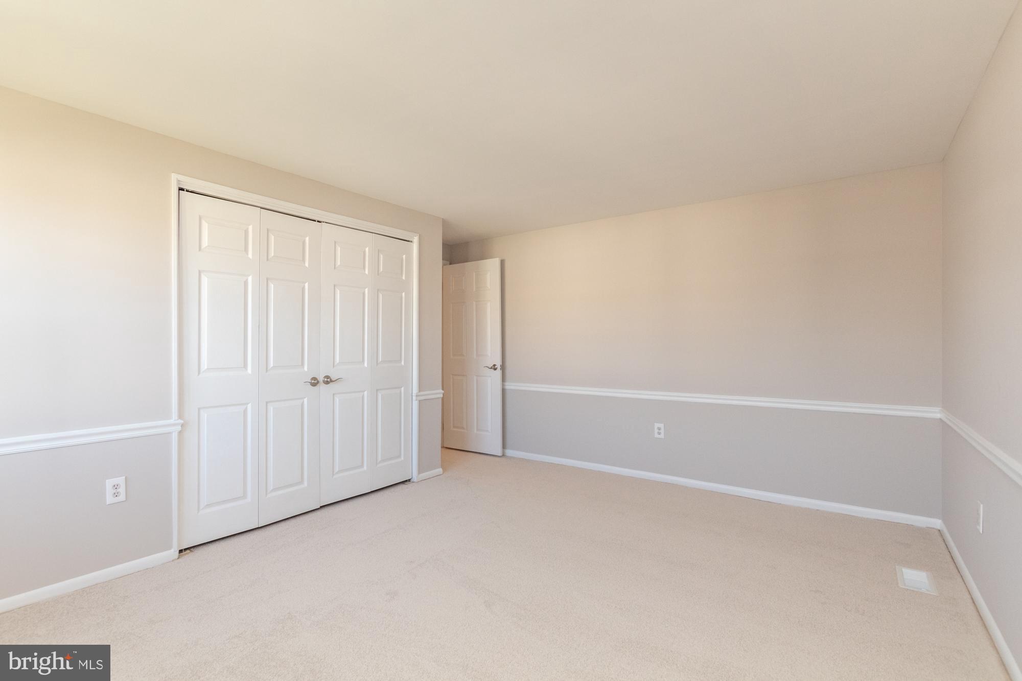 9221 Bowline Road Baltimore, MD 21236 - Photo 29 of 48 Chair railing continues in master bedroom