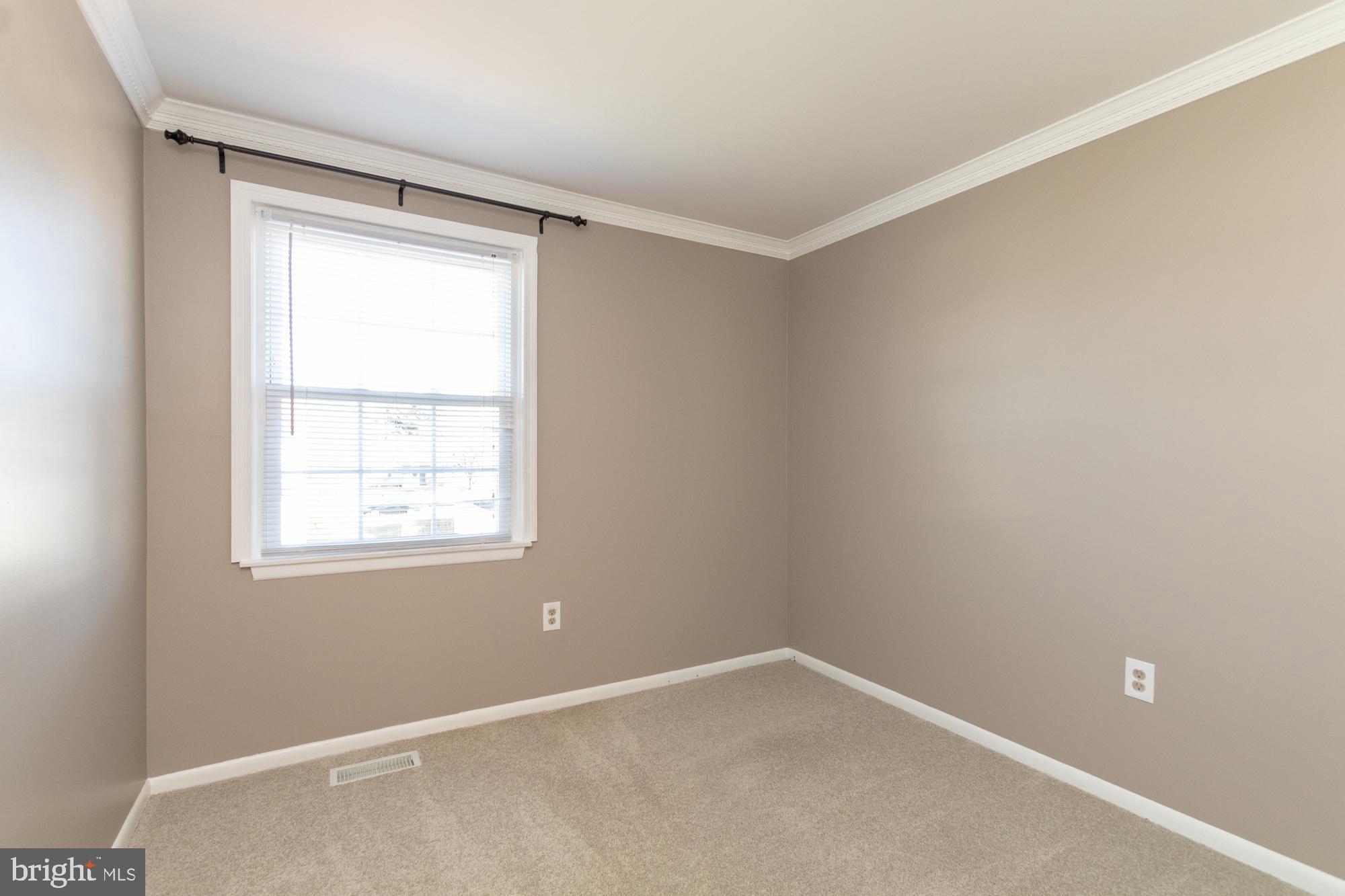 9221 Bowline Road Baltimore, MD 21236 - Photo 38 of 48 Neutral walls and crown molding