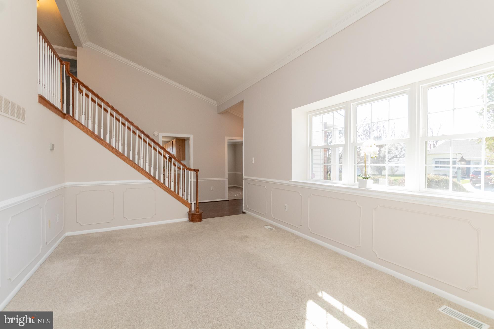 9221 Bowline Road Baltimore, MD 21236 - Photo 9 of 48 Dramatic staircase echoes cathedral ceiling