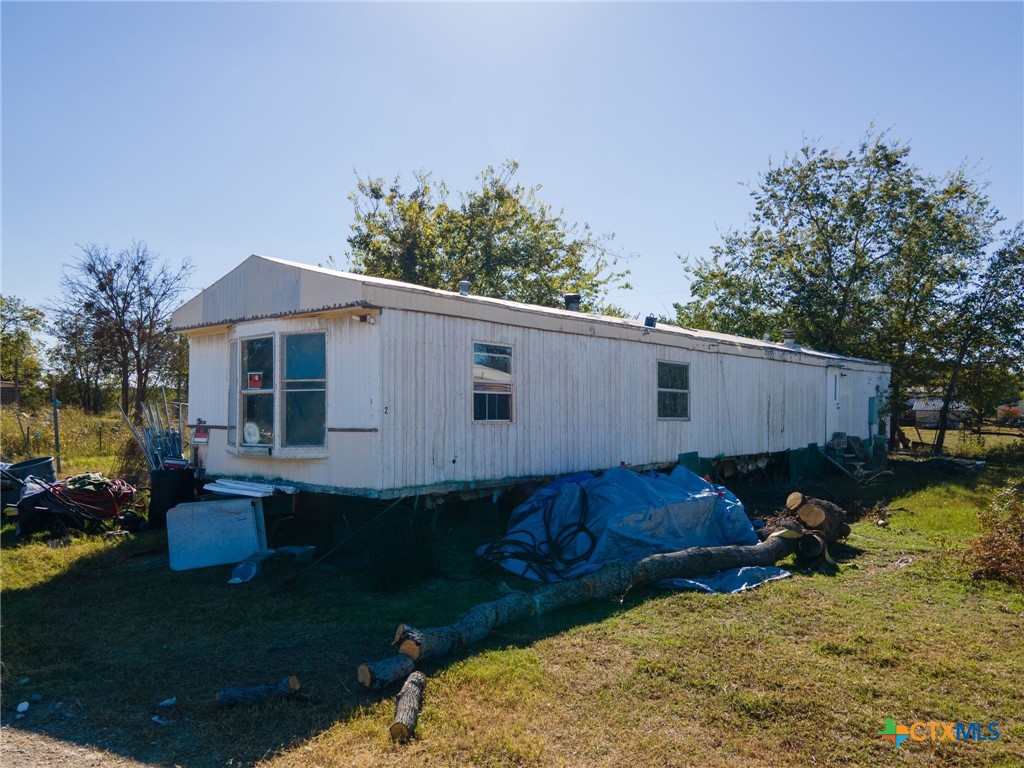 4592 County Road 3220 Kempner, TX 76539 - Photo 7 of 12 a view of a house with backyard and sitting area