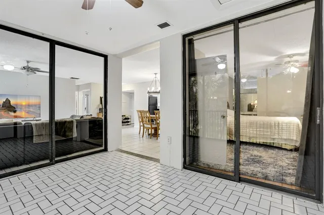 a bathroom with a glass shower door and a mirror