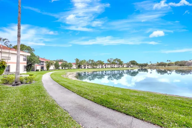a view of a lake with houses in the back