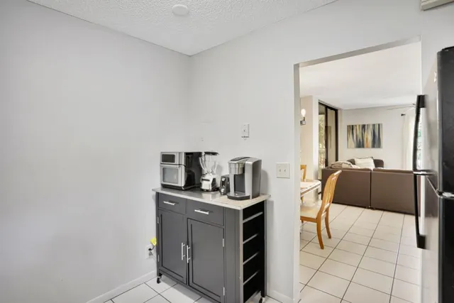 a kitchen with a stove and a refrigerator