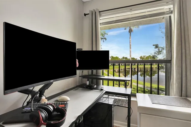 a view of a workspace with furniture