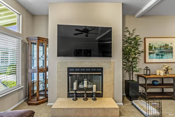 a living room with furniture and kitchen view