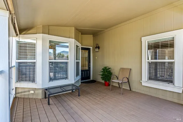 a view of a porch with furniture