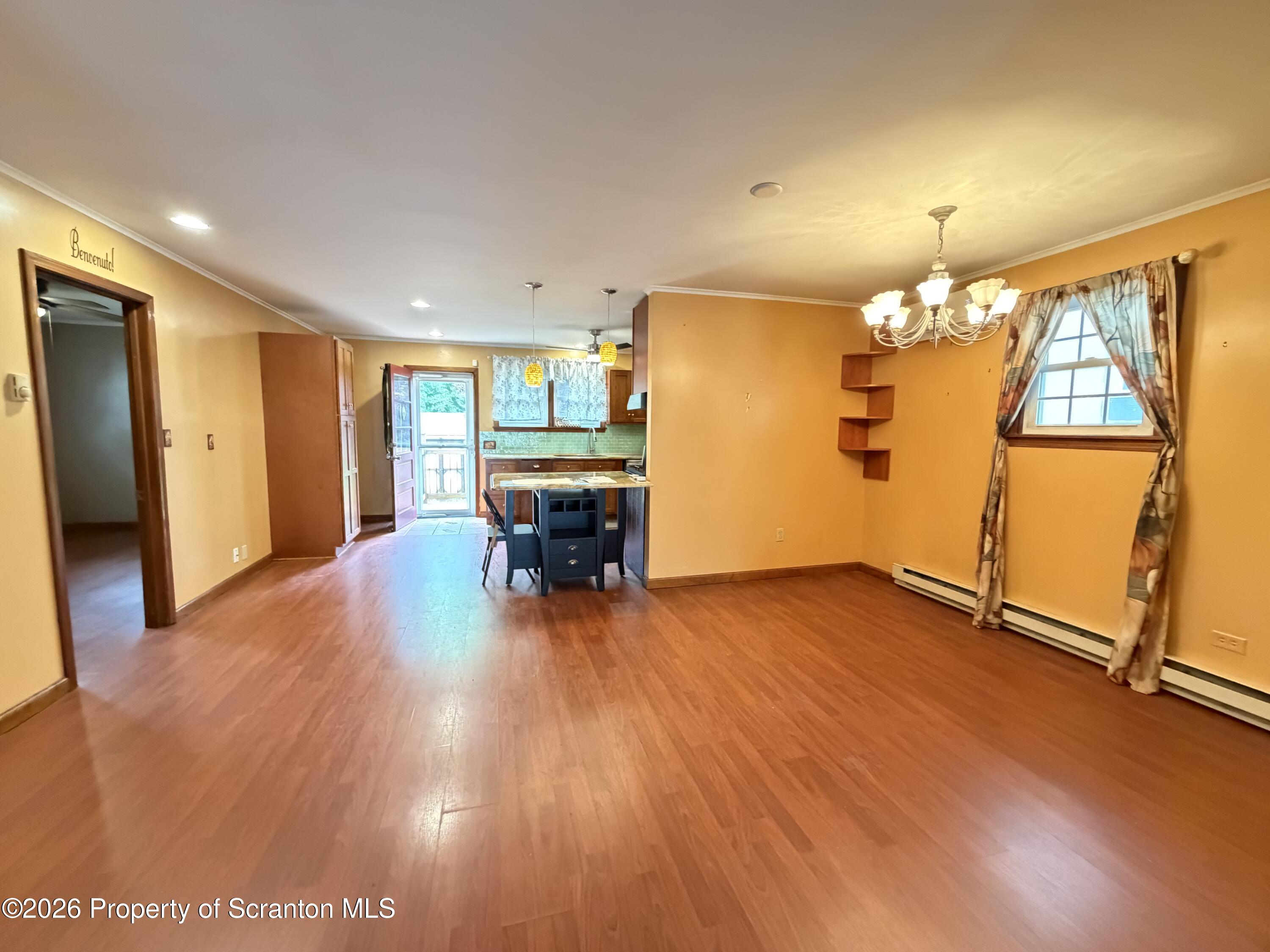 1019 Moosic Street Scranton, PA 18505 - Photo 33 of 43 a view of an empty room with window and wooden floor