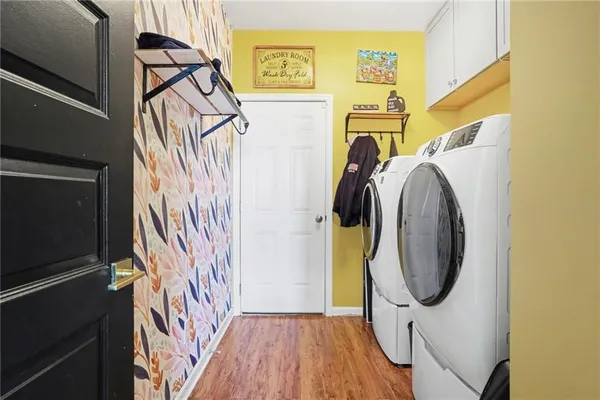 a utility room with dryer and washer