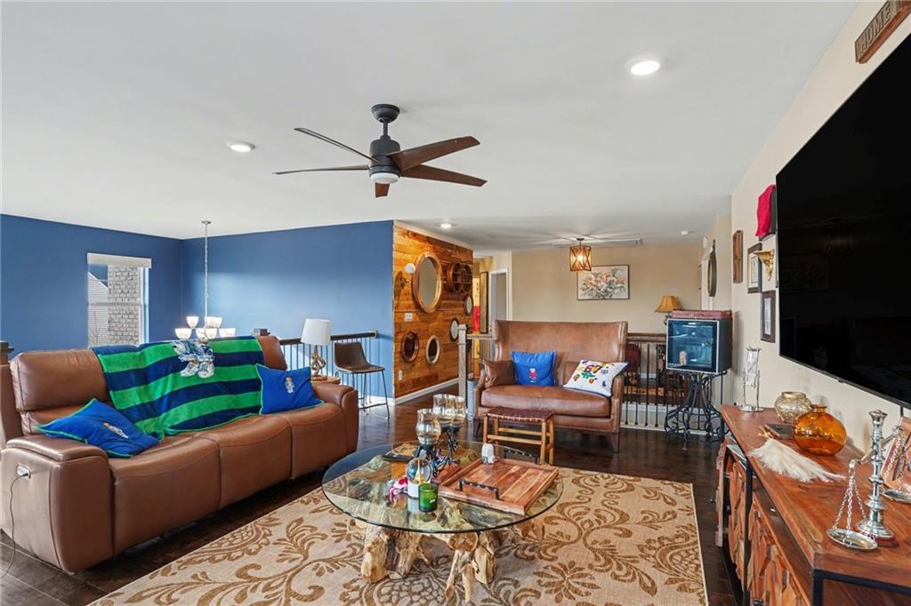 110 Canal Street Hampton, GA 30228 - Photo 24 of 41 a living room with furniture and a flat screen tv