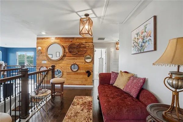 a living room with furniture and a clock