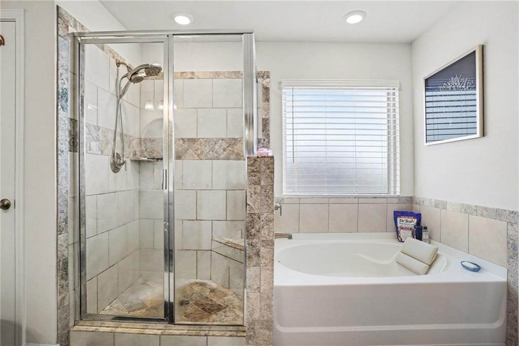 110 Canal Street Hampton, GA 30228 - Photo 30 of 41 a bathroom with a shower and a bath tub